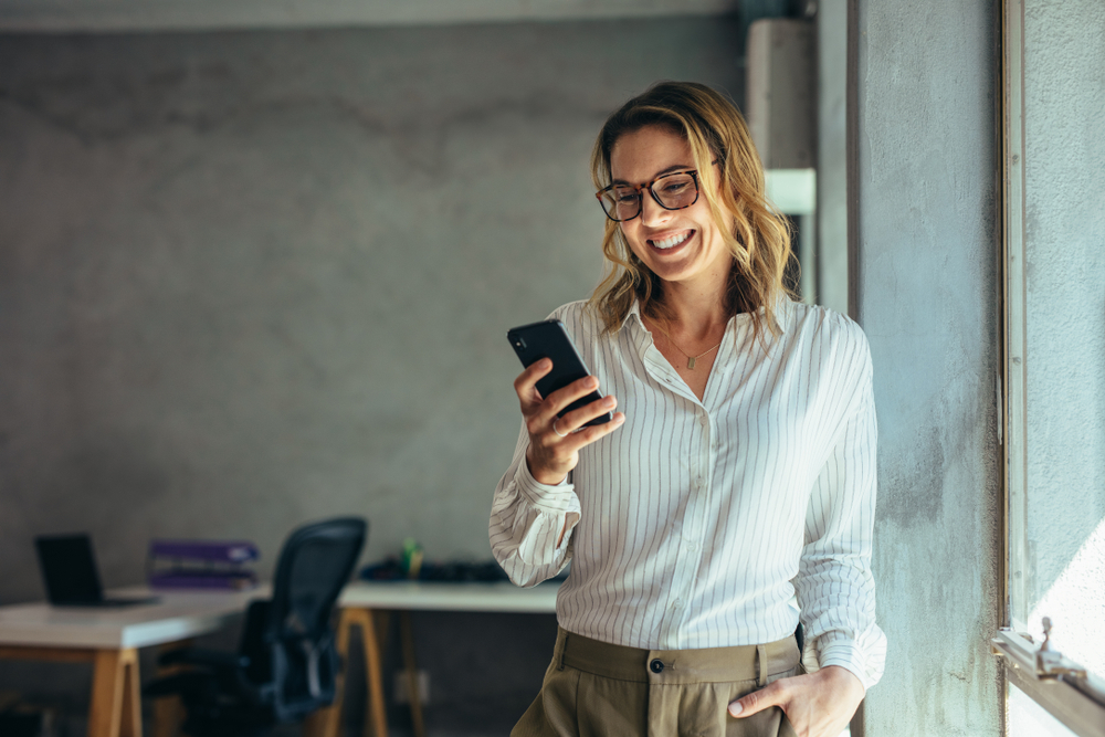 Woman entrepreneur using phone